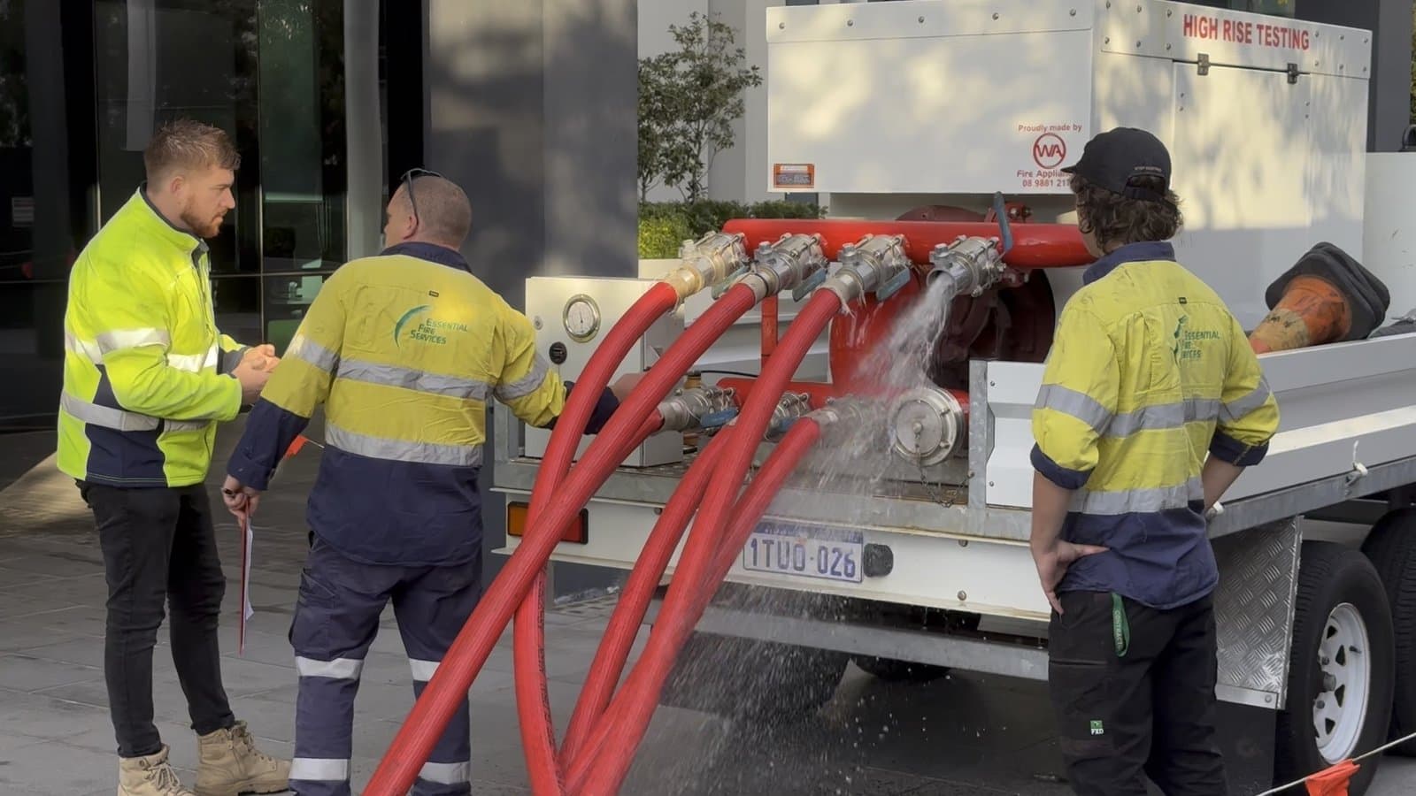 EFS team performing fire safety testing in a high-rise strata building
